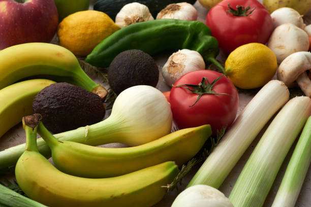 istock Fresh Produce Arrangement Featuring Red Apple, Tomatoes, and Leeks 2156780221
