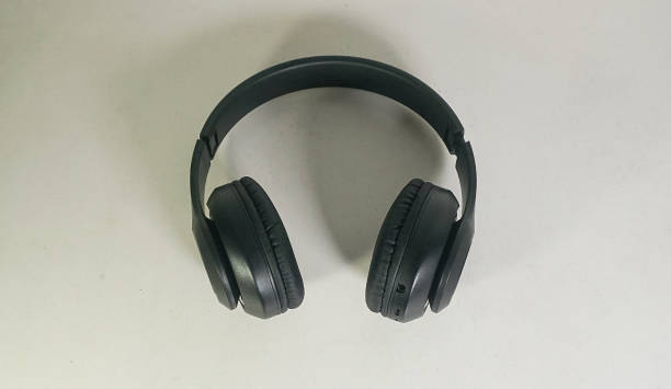 istock wireless headphones on the white background 2156780222