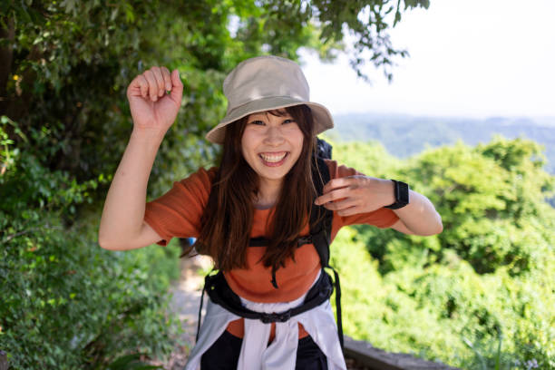 istock Happy female hiker reaching the mountain peak 2156781672