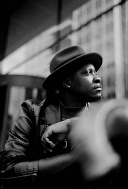 istock Dramatic chromatic portrait of man wearing a hat and looking away. 2156781937