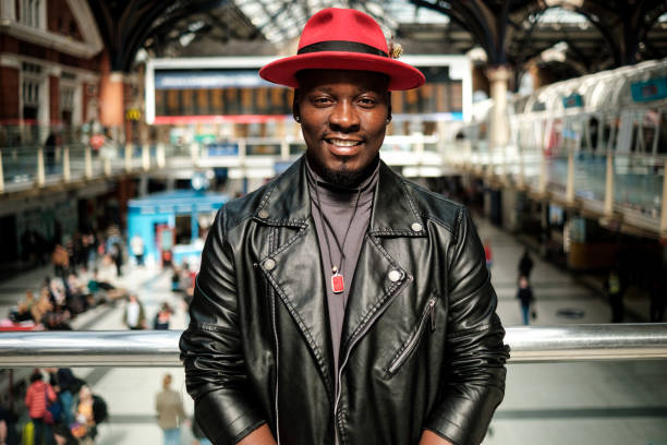 istock Smiling man looking at camera in a train station. 2156782024