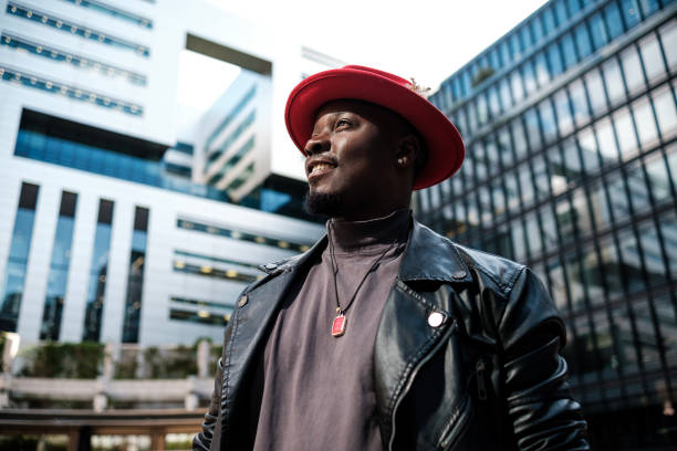 istock Side view of smiling male model surrounded by modern buildings. 2156782038