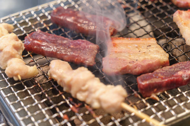 istock Typical Japanese barbecue cooking scene. Yakitori,beef, pork. 2156782313