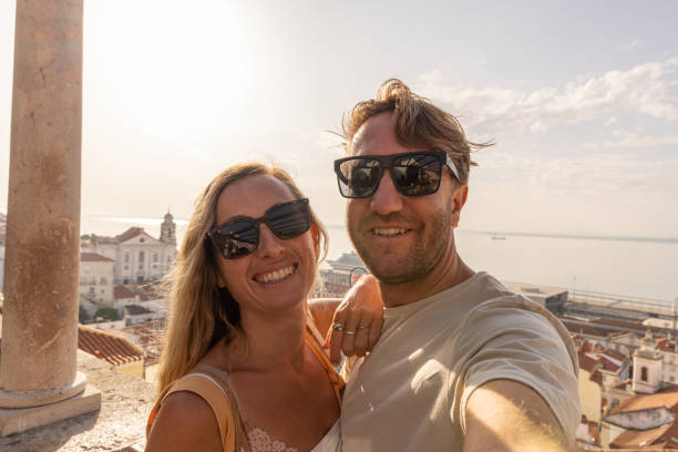 istock Smiling Couple Taking Selfie in Lisbon's Alfama District 2156783114