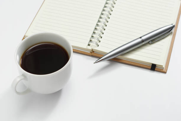 istock Cup of coffee, pen and notepad 2156783312
