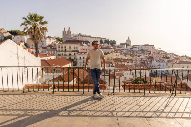 istock Man Relaxing on a Balcony Overlooking the Lisbon Cityscape 2156783343