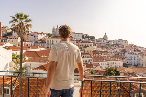 istock Man Admiring Rooftop City View 2156783413