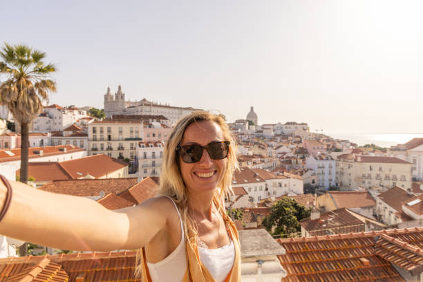 istock Woman Taking Joyful Selfie with City View 2156783446