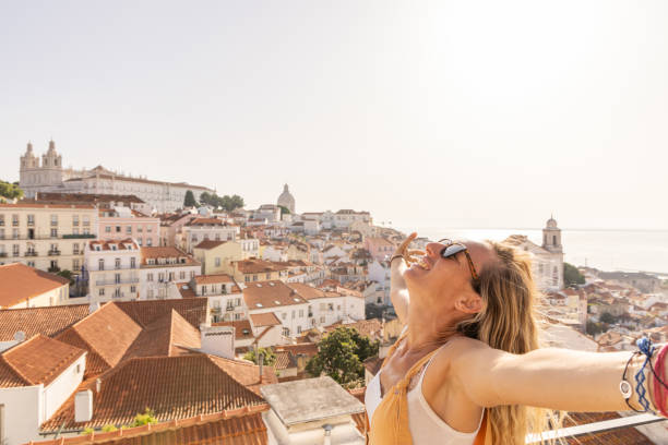 istock Woman basking in sunlight on rooftop 2156783522