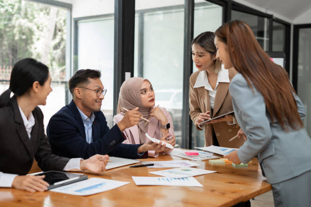 istock Asian business group discussing graph work at the office 2156783857