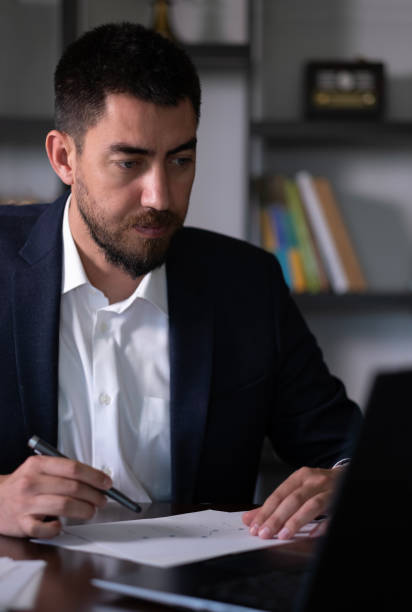 istock Handsome businessman working with laptop in his office 2156784274