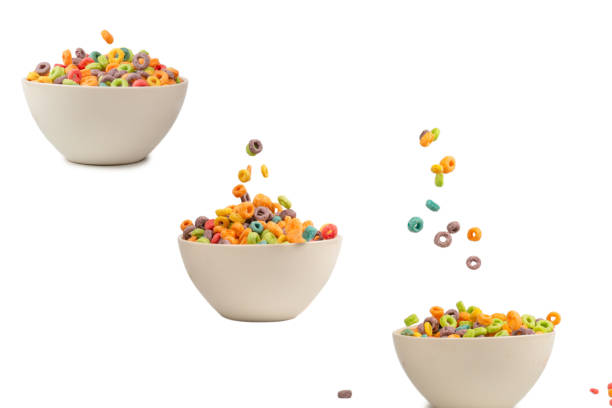 istock Colorful cereal box for morning breakfast. Corn flakes falling to the white bowl. Motion. 2156788483