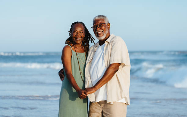 istock Joyful senior couple posing together on a sunny beach 2156788541