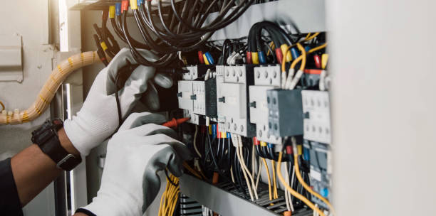 istock Electrician engineer tests electrical installations and wires on relay protection system. 2156790017