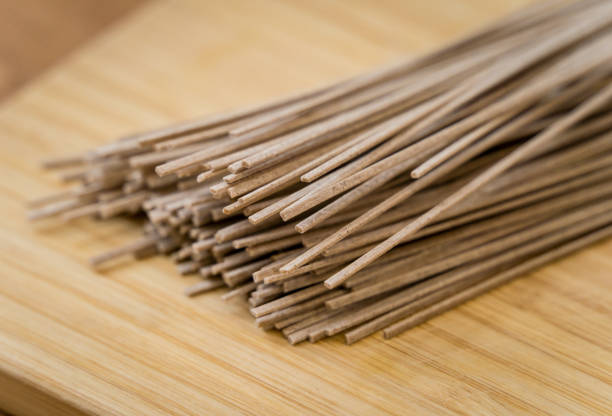 istock Cutting board with raw japanese buckwheat pasta 2156792681