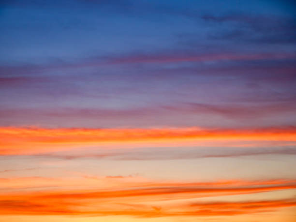 Natures canvas displaying an array of sunset colors, instilling peace and awe. Suitable for natural beauty promotions.