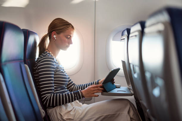 istock Young woman is travelling by plane 2156795700
