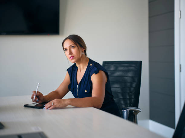 istock Woman Working Alone in a Business Office 2156797805
