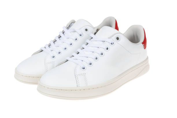 istock Pair of new white sneakers, isolated on white background 2156798976