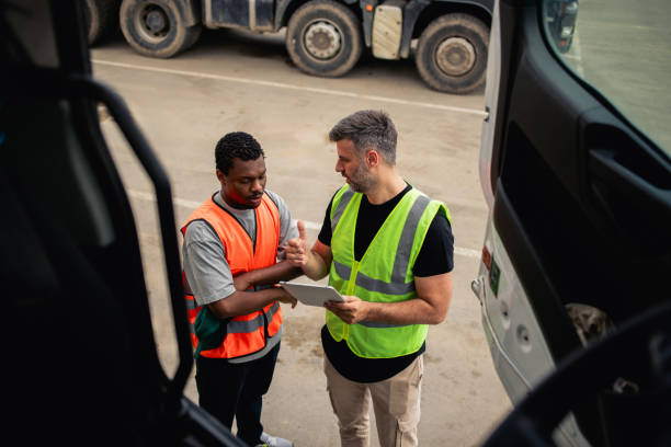 istock Two warehouse truck drivers planning the transportation 2156799962