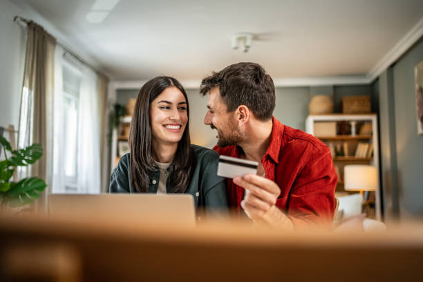 istock Young couple in love using laptop for online shopping 2156804243