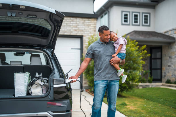 istock Diverse Father and Son Engaging in Electric Car Charging 2156804490
