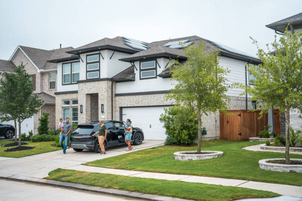 istock Family Unloading Groceries at Eco-Friendly Home 2156804500