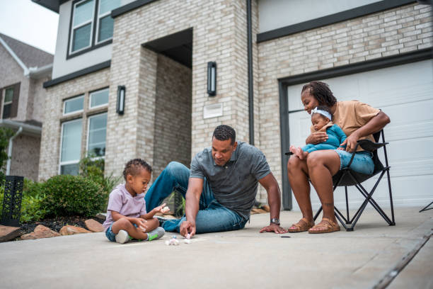 istock Diverse Family Unloads Groceries by Eco-Friendly Home 2156804514