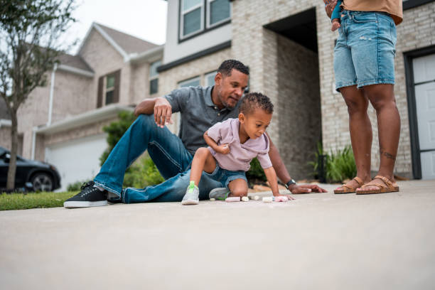istock Diverse Father and Son Chalk Art Creation at Home 2156804542