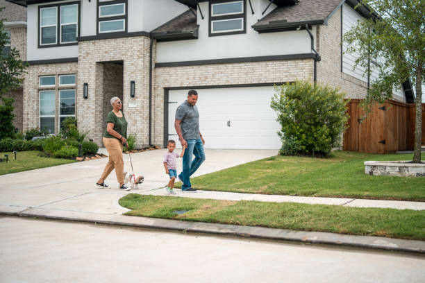 istock Diverse Family Enjoying a Walk by Eco-Friendly Home 2156804587