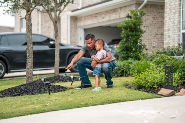 istock Diverse Father and Son Setting Up Solar Garden Lights 2156804604