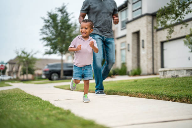 istock Diverse Father and Son Enjoying a Run Together 2156804608