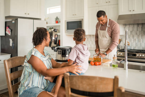 istock Diverse Family Engages in Cooking Activity in Home Kitchen 2156804886