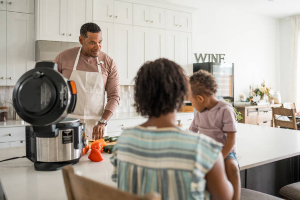 istock Diverse Family Engages in Cooking at Home 2156804891