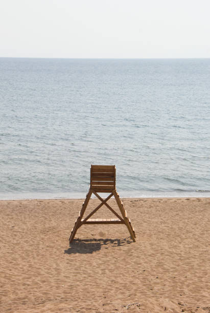 istock Lonely wood lifeguard tower on the beach 2156807545
