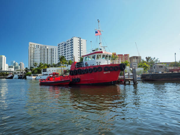 Miami, Florida 03-01-2019 Large red tugboat on Miami River on clear sunny March afternoon.