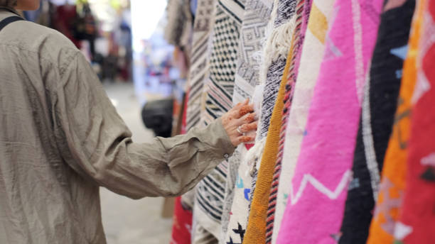 istock Young woman admires colourful fabric 2156813002