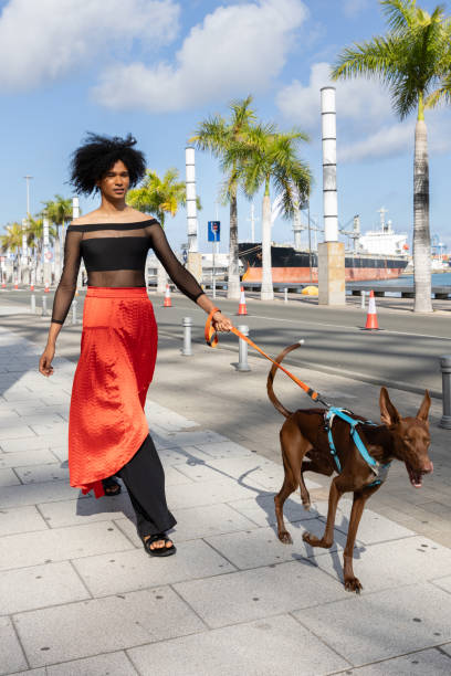 woman walking the dog while pulling the leash, woman dog pull leash fall