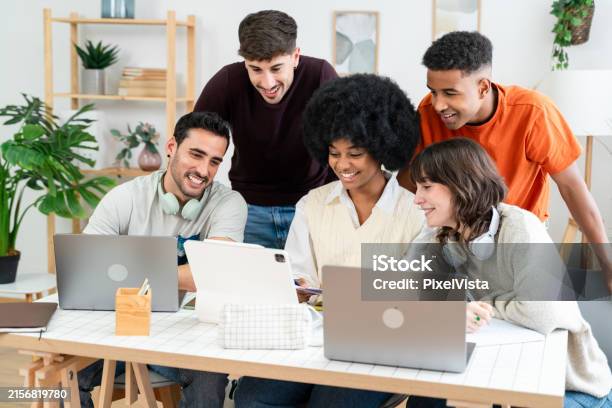 Group Project Using Laptops A Diverse Group Of Young Professionals Collaborates On A Project Using ...
