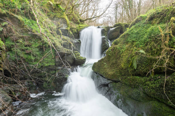 Long exposure of a waterfall on the Hoar Oak Water river at Watersmeet in Exmoor National Park