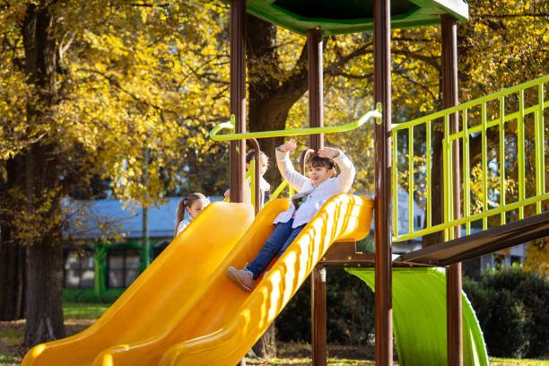istock Happy girls playing on the playground 2156821785