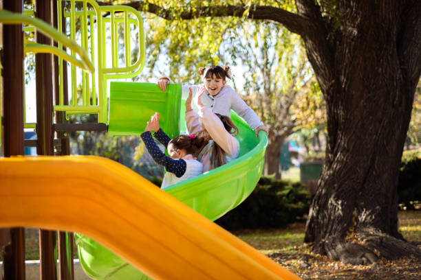 istock Happy girls playing on the playground 2156821787