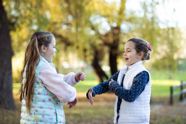istock Happy girls playing and hugging 2156821967