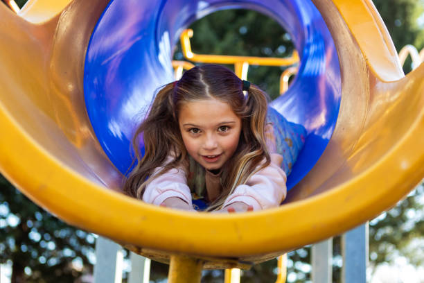 istock Happy girl playing on the playground outside 2156823113