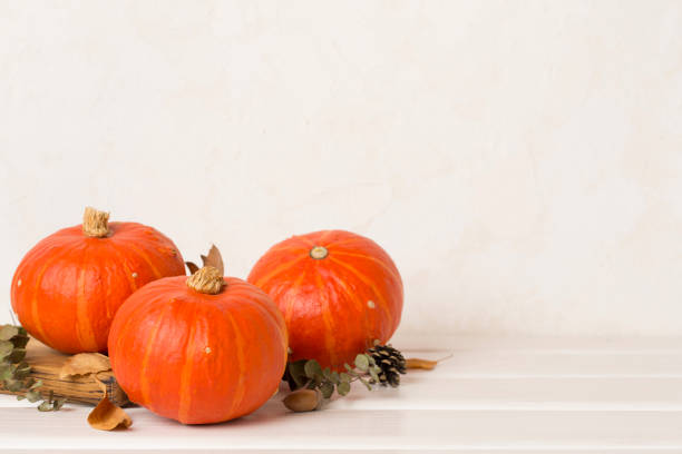 istock Orange pumpkins with autumn decor on table 2156823638