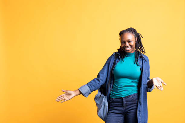 istock Serene girl doing nonchalant carefree hand gesturing, studio background 2156824122