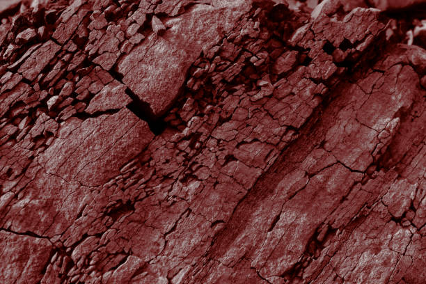 istock background of stones and minerals, mining origin in red 2156824135