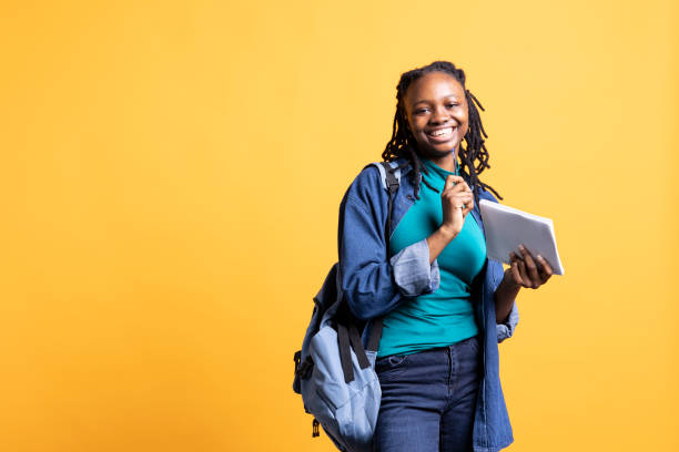 istock Joyous student holding notebook with research done for university courses 2156824919