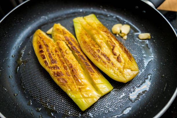 istock Delicious grilled eggplants with garlic on the fried pan 2156825783