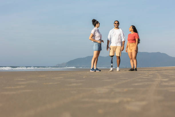 istock Group of friends chatting on the beach 2156837254